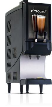 A black and silver NitroPro Mini Cold Brew Dispenser with two taps displays two glasses of layered nitro coffee. This countertop cold brew dispenser stands on four legs with a metal drip tray beneath the taps and is labeled nitropro at the top.