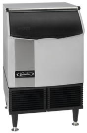 A stainless steel and black under counter ice maker with a front door and black vented panels at the base, standing on four legs. The brand Cornelius logo is visible on the front panel, showcasing its durable stainless steel construction.