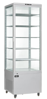 A tall, silver Omcan USA refrigerated display case with a 500 liter capacity features five wire shelves, clear glass sides and front door, a left-side handle, vented bottom section, and small wheels. The fridge is empty and set against a plain background.