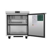 A small, stainless steel freezer stands on wheels with its door open. Inside are two shelves and vents at the back. Warning labels are visible on the door. The modern, compact design resembles an Atosa Undercounter Freezer, ideal for clinical use.