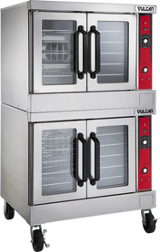 The Vulcan VC44ED is a stainless steel, electric double-deck convection oven on wheels, featuring glass-front doors, black handles, right-side control panels with dials and buttons, and “Vulcan” branding at the top right of both ovens.