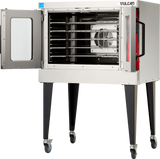A stainless steel Vulcan VC5ED Electric Single-Deck Oven on wheels stands with its glass door open, revealing multiple wire racks and a visible fan inside. This commercial convection oven features four sturdy black legs and a right-side control panel.