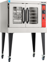 The Vulcan VC5GD is a stainless steel commercial convection oven with two glass doors, black handles, and a right-side control panel featuring dials and buttons. This gas single-deck oven stands on four tall black legs with wheels and includes multiple interior racks.