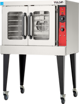 A stainless steel Vulcan VC5GD gas single-deck oven with double glass doors, black handles, a red control panel with dials and buttons, interior racks visible, and four black legs on wheels for mobility.
