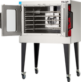 A Vulcan VC5GD gas single-deck convection oven stands on tall legs with wheels. Its side door is open, showing multiple metal racks inside and a large fan at the back. The control panel is visible on the right side of the oven.
