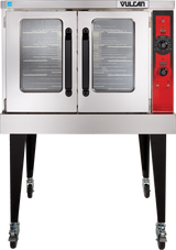 Commercial stainless steel Vulcan VC5GD gas single-deck convection oven on black legs with four wheels. Features double glass doors, multiple wire racks, and a red control panel with dials and switches. The brand Vulcan appears above the doors.