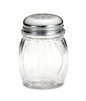 A clear, BPA free polycarbonate jar shaker with a round, ridged body and a shiny metal lid featuring several small holes for dispensing seasoning, shown against a plain white background.