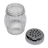 A clear, BPA free shaker jar with a wide mouth and decorative vertical grooves sits beside its detached round metal lid, which features multiple evenly spaced holes for dispensing contents. The jar and lid rest on a plain white background.