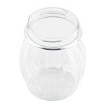 A clear, empty TableCraft Swirl Shaker Jar with a round, ribbed body and a wide, open mouth. This 6 oz. jar is photographed from a slightly elevated angle on a white background, highlighting its transparent surface and simple design.