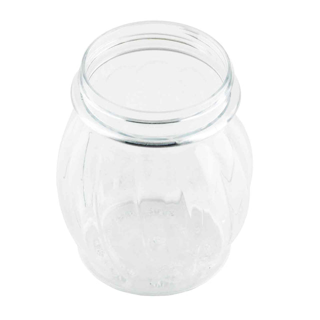 A clear, empty TableCraft Swirl Shaker Jar with a round, ribbed body and a wide, open mouth. This 6 oz. jar is photographed from a slightly elevated angle on a white background, highlighting its transparent surface and simple design.