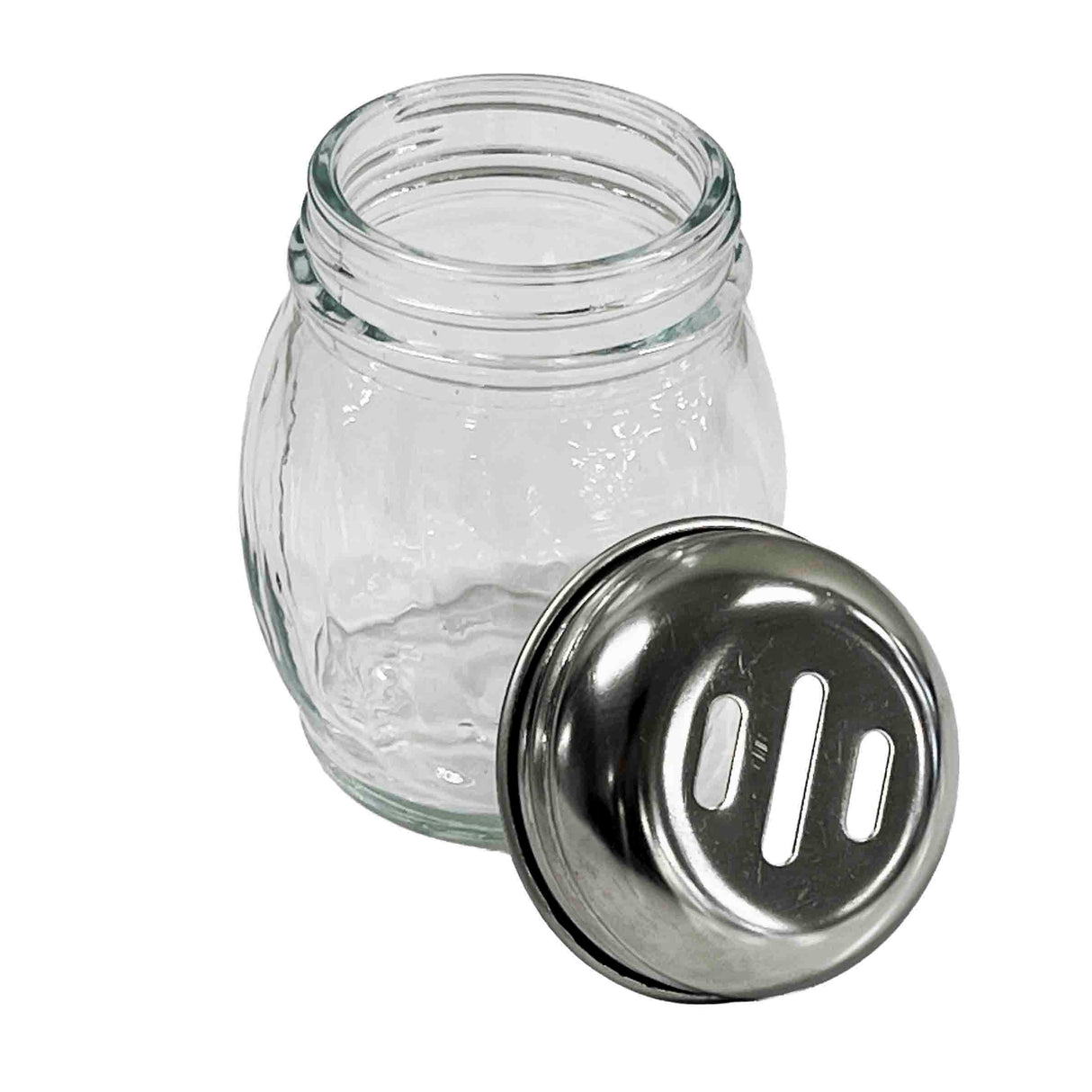 A clear, BPA Free glass shaker jar with a stainless steel lid placed beside it. The lid has three rectangular holes for dispensing grated cheese or spices. The simple jar features gentle curves and is shown against a plain white background.