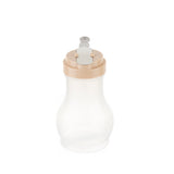 A BPA-free, translucent plastic syrup dispenser with a beige flip-top lid and metal clasp sits empty on a white background. Its curved shape is likely designed for easy dispensing of liquids like syrup or honey.