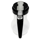A BPA free syrup dispenser with a black handle and lid, featuring a silver metal lever for pouring. The rounded glass body is shown from above, highlighting the handle and lever—plus, it's dishwasher safe for easy cleaning.