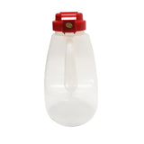 A large, clear, BPA free plastic jug with a built-in handle and a wide red screw-on cap. The cap features a gold and green circular sticker on top. This 48 oz jug appears empty and is photographed against a plain white background.