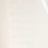 Close-up of a BPA free white plastic surface with embossed measurement markings in ounces, showing increments of 12, 16, 20, 24, 28, and 32 oz. The markings are aligned vertically on the left side.
