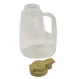 A clear BPA free plastic measuring jug with a handle and graduated markings stands upright. In front lies its detached tan-colored lid with a flip-top spout. The dishwasher safe jug is empty, set against a plain white background.