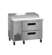 A commercial Hoshizaki stainless steel pizza prep table featuring two drawers, a raised ingredient compartment with a metal lid, a white cutting board surface, ventilation grilles, control panel, and four caster wheels for mobility.
