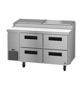 A stainless steel pizza prep table with four refrigerated drawers, a white prep surface on top, and two hinged lids; the unit is on wheels and features a small digital display on the front left.