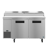 A commercial Hoshizaki stainless steel refrigerator with two doors, a digital temperature display on the lower left, vent slats, a flat worktop like a pizza prep table, and two lids on top. Four wheels offer mobility and modern industrial design.