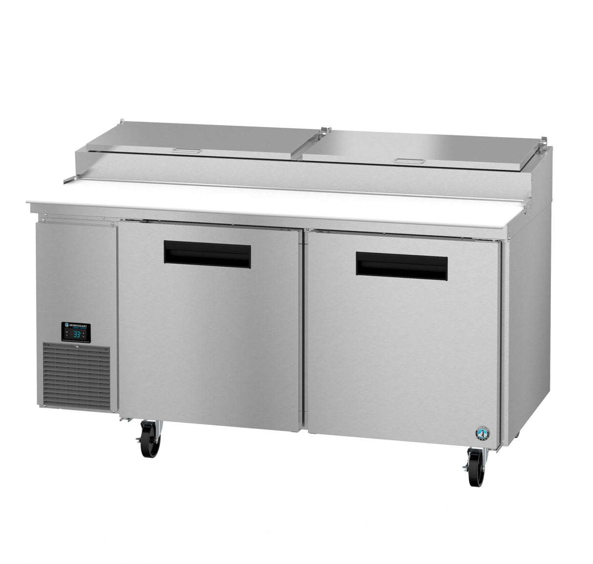 The Hoshizaki Steelheart Series pizza prep table features two doors, a digital temperature display on the left, dual top lids, four caster wheels, and a white cutting board running along the front beneath the compartment lids.