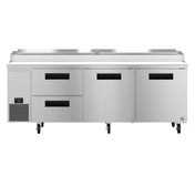 A large stainless steel pizza prep table features two refrigerated drawers on the left, two swing doors on the right, a digital control panel, bottom-left ventilation, four caster wheels, and an integrated prep station on top.