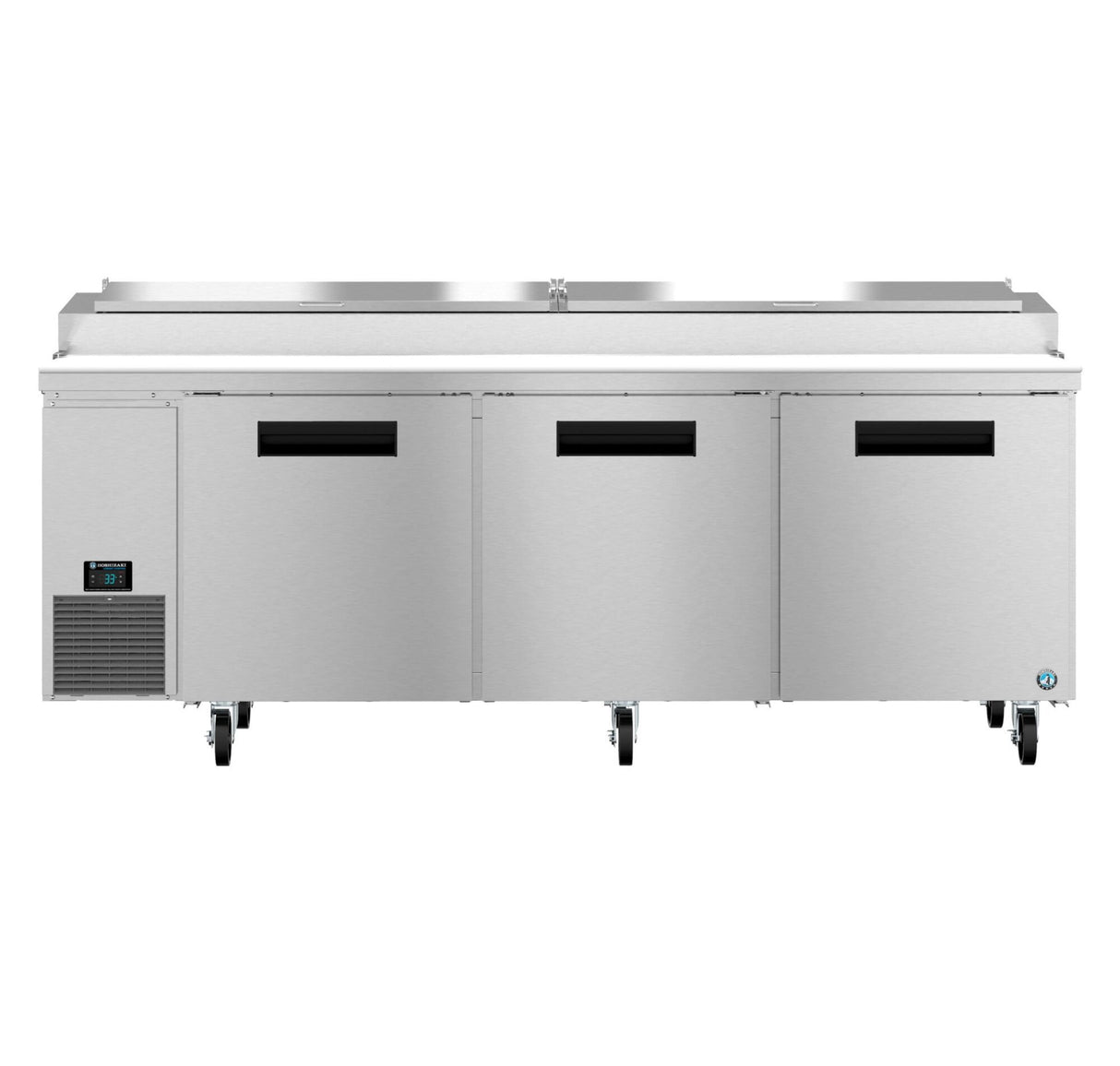 A large Hoshizaki Steelheart stainless steel commercial refrigerator with three doors, black handles, digital display left, bottom-left ventilation, and four caster wheels. The raised top lid adds convenient storage or pizza prep table space.