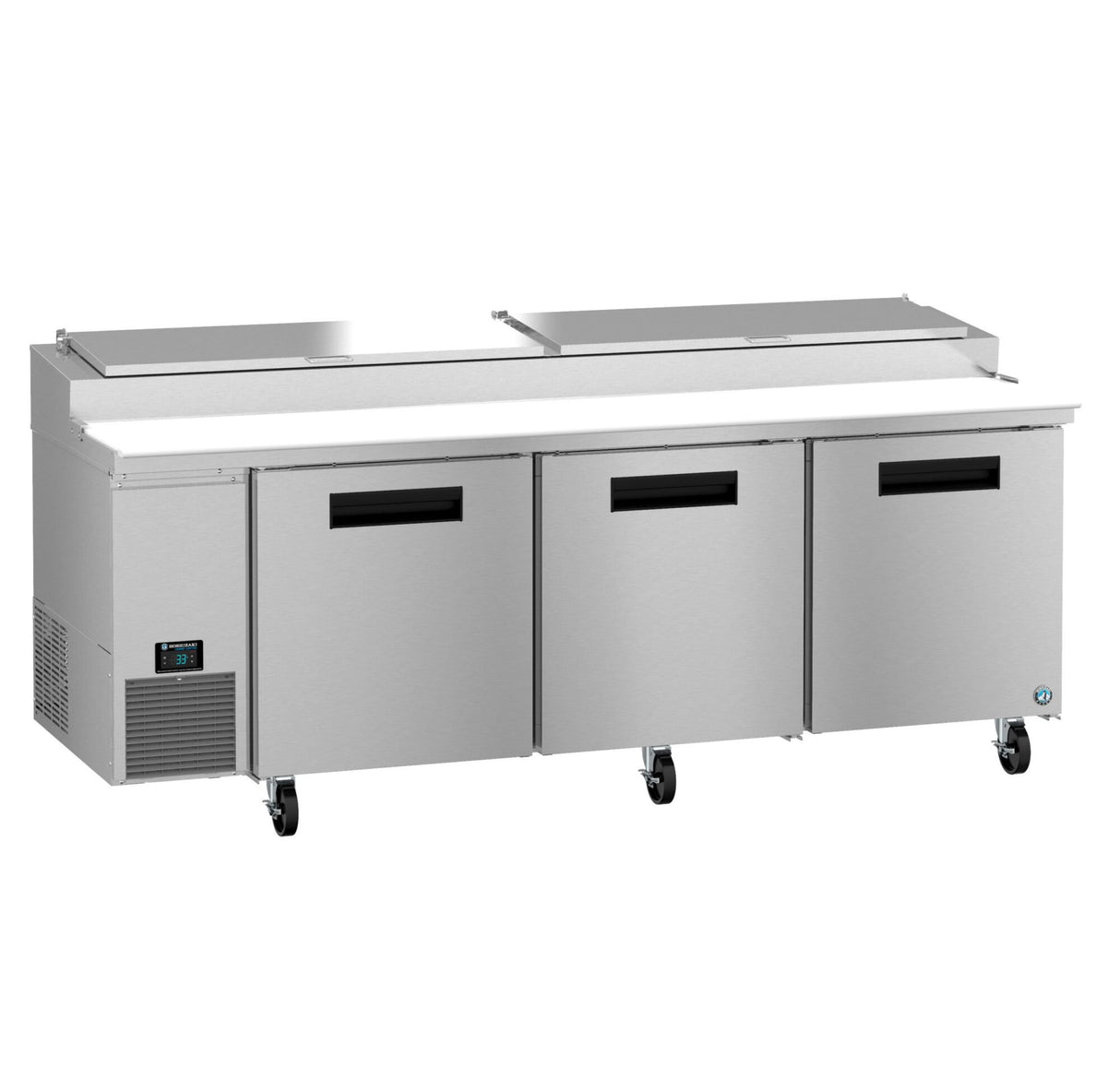A commercial Hoshizaki Steelheart pizza prep table with three refrigerated doors, stainless steel cutting board surface, raised ingredient storage with hinged lids, black handles, left-side control panel, and caster wheels for mobility.