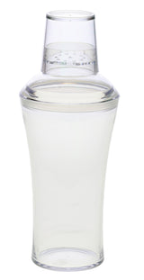 A clear, 20 oz cocktail shaker made of transparent plastic is shown upright with its lid securely on top. The tapered body curves inward toward the middle, while the dome-shaped lid features a built-in strainer for easy pouring.