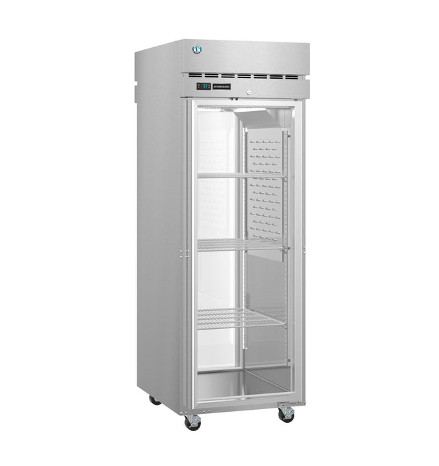 A tall, stainless steel Hoshizaki Steelheart Series Refrigerator stands on four wheels. Its transparent single glass door reveals three adjustable wire shelves inside. The top panel displays a digital control panel and vent openings, reflecting a clean, modern design.