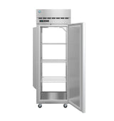 A commercial refrigerator stands on four wheels with its single door open. Inside, three adjustable metal wire shelves and a flat bottom shelf provide storage. The top section features a digital control panel and vent slots for efficient cooling.