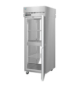 A tall, stainless steel Steelheart Series Refrigerator with a single glass door is open, revealing several empty wire shelves inside. The fridge stands on caster wheels for mobility and features a control panel above the door. Clean and modern in appearance.