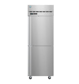 A tall Steelheart Series Refrigerator with two vertical doors and ventilation slots at the top stands on four wheels. An electronic temperature display and control panel are visible near the top section of this stainless steel refrigerator.