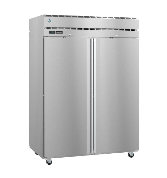 A large, stainless steel Steelheart Series Refrigerator with double doors, vertical handles, a digital display, top ventilation grille, and four caster wheels. Its clean surface reflects light, making this pass-thru refrigerator ideal for any commercial kitchen.