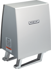 A stainless steel Hobart commercial dishwasher booster heater with a rectangular box shape, slanted front, and two metal supports at the bottom. The Hobart logo is on the front, alongside safety labels near the #12 hub for Power Drive Unit compatibility.