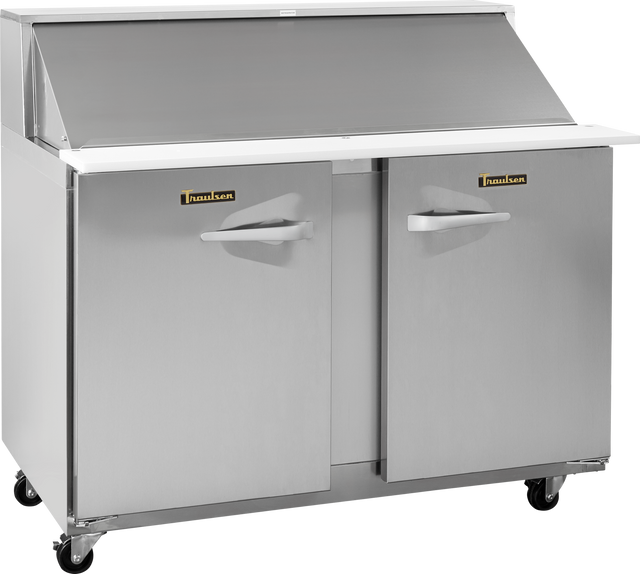 A compact prep table refrigerator by Traulsen, featuring two stainless steel doors, a white roll-top lid, and four black caster wheels. This clean, sleek unit is designed for professional kitchens and offers exceptional functionality.