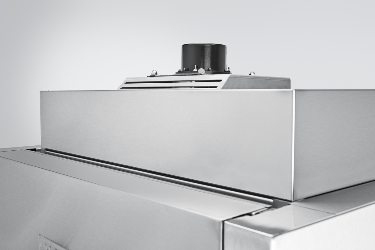 A close-up view of the top section of a stainless steel Hobart Advansys ventless pot pan washer, featuring clean, reflective surfaces and a black cylindrical vent mounted on top against a plain light gray background.