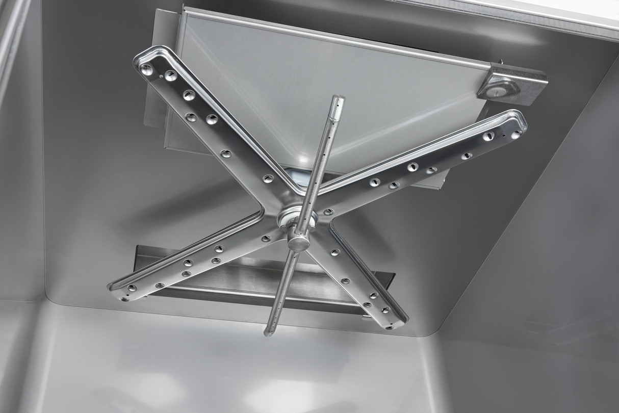 Close-up view of a large metal cross-shaped locking mechanism on a secure vault door, its polished steel surface gleaming like a Hobart Advansys commercial utensil washer, with rivets and central handle reflecting the smooth interior.