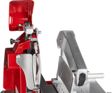 Close-up of a commercial Fly Wheel Slicer with a shiny red and silver body. The Berkel slicer features a chromium-plated carbon steel knife, black handle, and precise adjustment knobs—ideal for slicing meats or cheeses in any deli or kitchen setting.