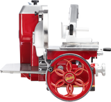 A red and silver vintage-style Fly Wheel Slicer with a large decorative wheel labeled Berkel, a hand-crank handle, and retro detailing. The Berkel 330M features a chromium-plated carbon steel knife and polished metal components, set against a white background.