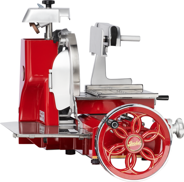 A vintage-style Berkel 330M Fly Wheel Slicer in red and silver, featuring a large hand-crank wheel, a chromium-plated carbon steel knife, ornate detailing, and the iconic Berkel logo at the center of the wheel.