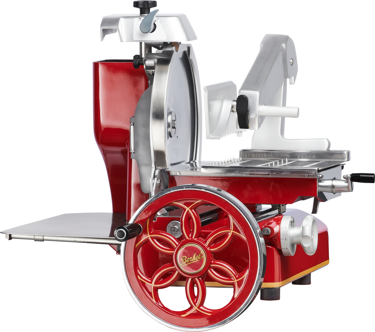 A red and silver vintage-style Fly Wheel Slicer features ornate metalwork, a large hand-crank wheel with floral spokes, a chromium-plated carbon steel knife, a platform for food, and adjustment knobs, all against a white background.