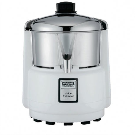 A white and chrome Waring Commercial Juice Extractor with a cylindrical shape, central spout, and black top knob sits on a flat surface. This compact juice extractor is ideal for international use and displays the brand label on the front.