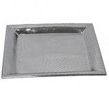 A rectangular Remington Collection tray with a hammered texture, slightly raised edges, and a shiny silver finish. This stainless steel tray is empty and photographed against a plain white background.