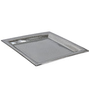 A rectangular, metallic stainless steel tray with slightly raised edges and a hammered texture, giving the surface a dimpled, reflective appearance. The tray is empty and shown on a white background.