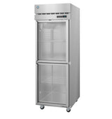A tall Steelheart Series Refrigerator stands on four wheels. This stainless steel reach-in refrigerator features two glass doors—one above the other—revealing wire shelves, an electronic control panel above the top door, and sleek ventilation grilles.