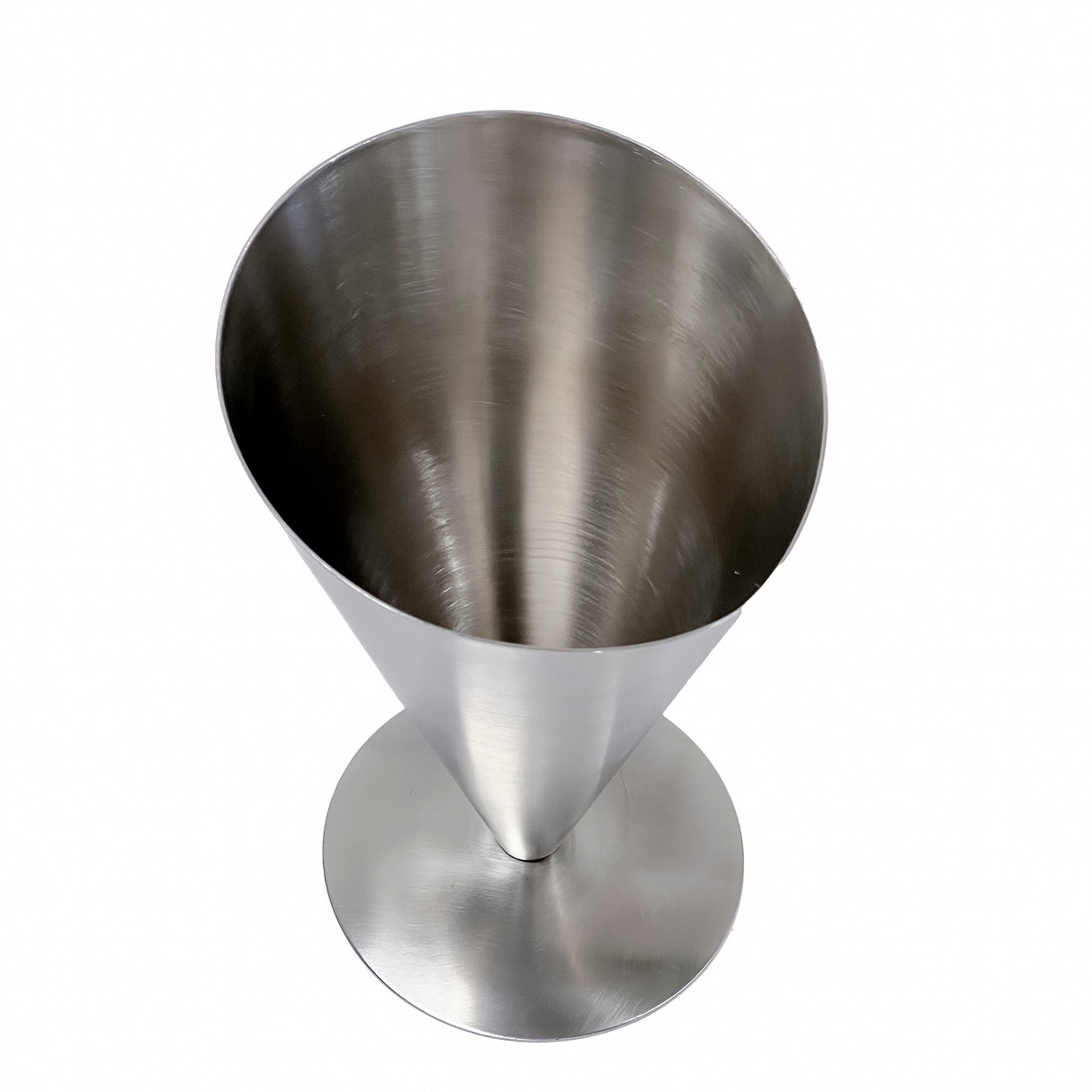 A stainless steel Fry Cone with a wide opening tapers to a narrow base and stands upright on a round flat base. The brushed metal surface has a subtle sheen, and the vessel is photographed against a plain white background. Dishwasher safe.