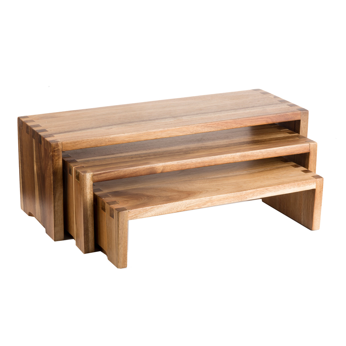 Three nested rectangular tables crafted from acacia wood, each slightly smaller to form a stylish nesting set. With clean, modern lines and visible dovetail joints, these Cascade Risers highlight impeccable craftsmanship.