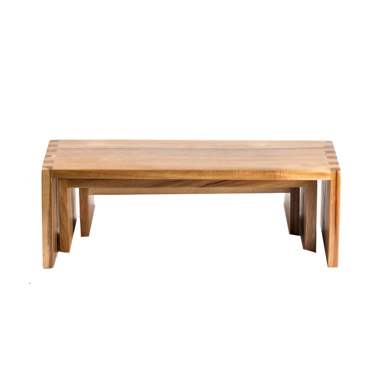 A rectangular acacia wood coffee table with a natural finish, clean lines, and slightly outward-angled legs. The minimalist, modern design highlights the wood grain and craftsmanship. Perfect as a standalone piece or paired in a nesting set. Photographed on white background.
