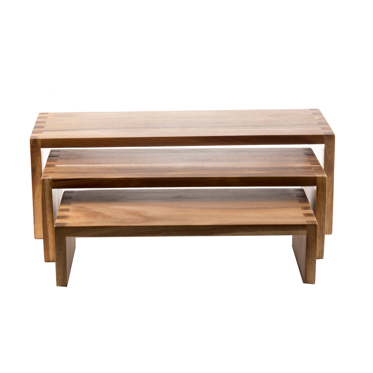 Three rectangular acacia wood shelves of different sizes are stacked in a nesting set, each with a smooth finish and visible dovetail joints. The light brown Cascade Risers showcase natural wood grain patterns for an elegant display.