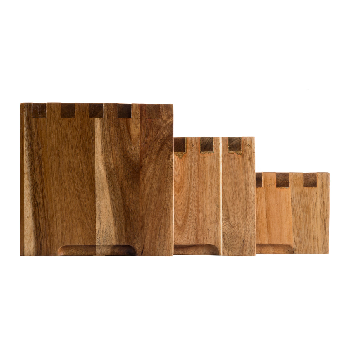 Four rectangular acacia wood cutting boards, designed as a nesting set, are arranged in a row from largest to smallest. Each board features visible wood grain, dovetail joints at the top, and a semi-circular groove at the bottom center on a white background.